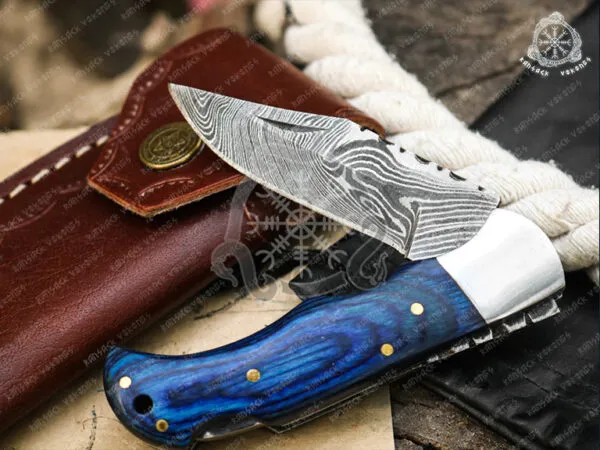 Damascus Folding Pocket Knife — Hand-Forged, 6.5″ Overall, Hardwood Handle, Leather Sheath - view 2
