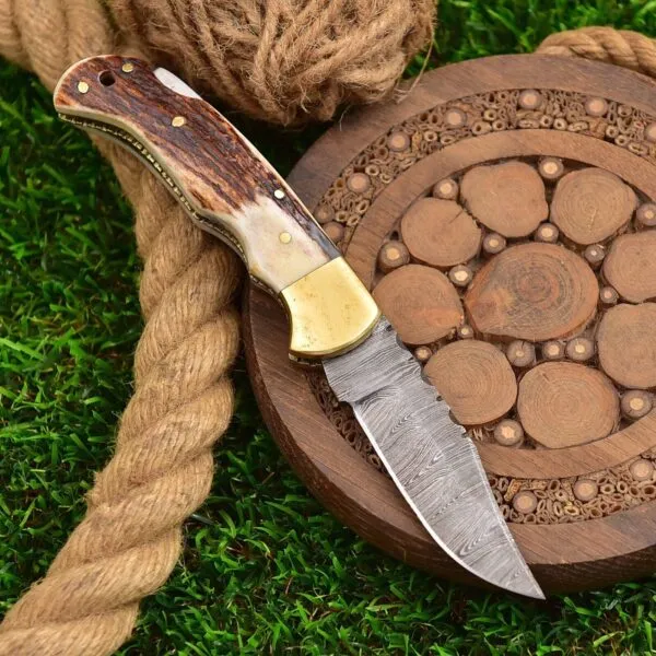 Damascus Folding Pocket Knife — Hand-Forged, 7″ Overall, Stag Horn Handle, Leather Sheath - view 2
