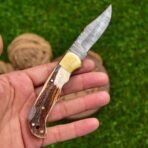 Damascus Folding Pocket Knife — Hand-Forged, 7" Overall, Stag Horn Handle, Leather Sheath - Image 4