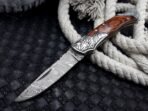 Damascus Folding Pocket Knife — Hand-Forged, 7" Overall, Wood Handle, Leather Sheath | Engraving Available - Image 10
