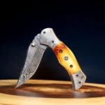 Damascus Folding Pocket Knife — Hand-Forged, 8.5" Overall, Camel Bone Handle, Leather Sheath