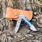 Damascus Folding Pocket Knife — Hand-Forged, 8" Overall, Pakka Wood Handle, Leather Sheath