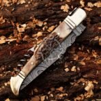 Damascus Folding Pocket Knife — Hand-Forged, Stag Horn Handle, Leather Sheath - view 4