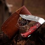 Damascus Folding Pocket Knife — Hand-Forged, 7" Overall, Hardwood Handle, Leather Sheath | Engraving Available