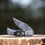 Damascus Folding Pocket Knife — Hand-Forged, 7.5" Overall, Ram Horn Handle, Leather Sheath