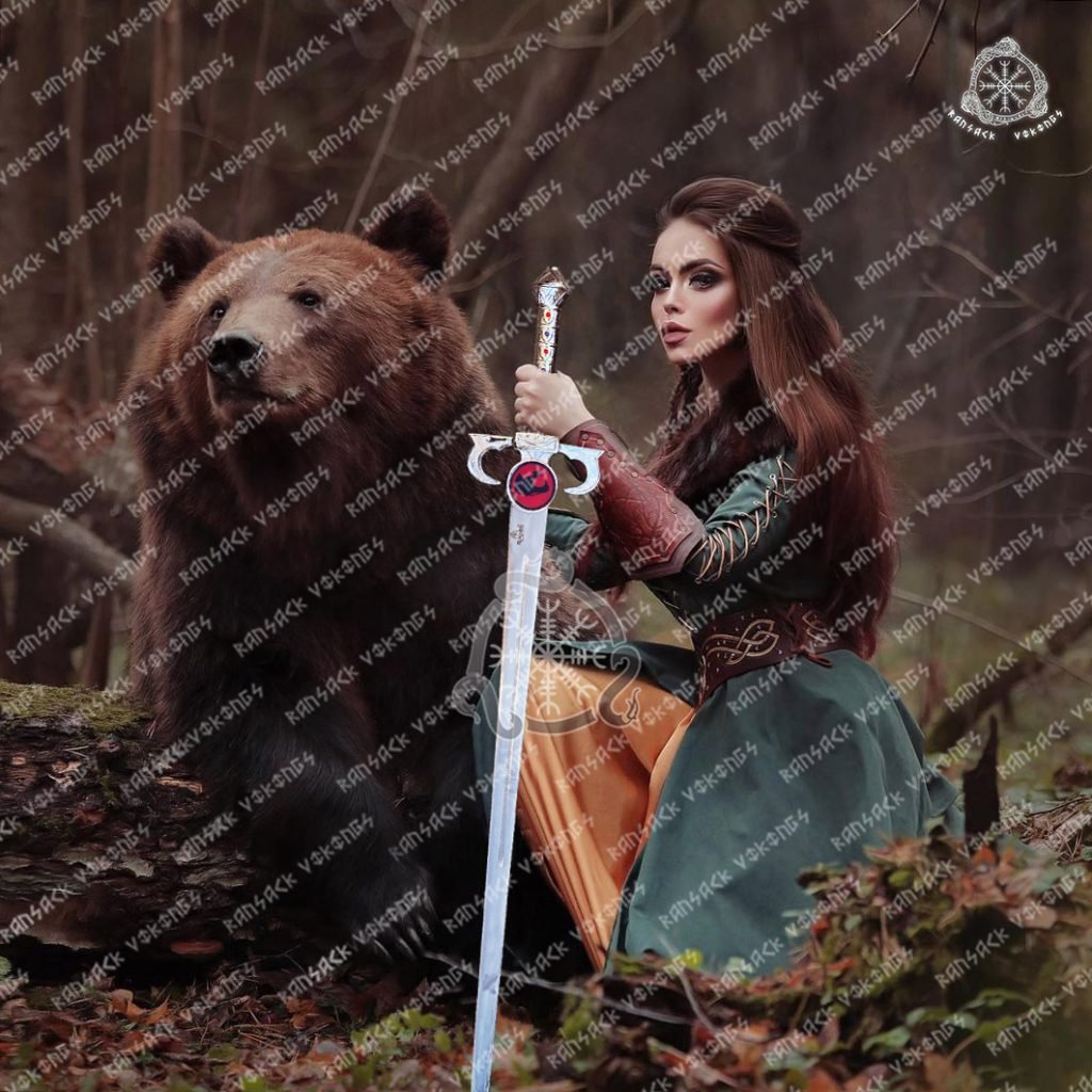 ThunderCats sword replica with a polished stainless steel blade and cast fantasy fittings carrying a cat emblem, forty inches overall, shown full length on a plain background