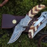Damascus Folding Pocket Knife — Hand-Forged, 7.5" Overall, Ram Horn Handle | Engraving Available
