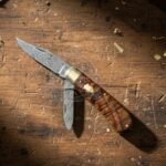 Damascus Folding Pocket Knife — Hand-Forged, Walnut Handle, Leather Sheath