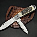 Damascus Folding Pocket Knife — Hand-Forged, Stag Horn Handle, Leather Sheath | Engraving Available