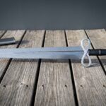 Wyrmfold Hand Forged Damascus Sword with Infinity Loop Guard and Mjolnir Pommel | 29 Inch Patterned Blade | Black Leather Grip and Steel Mounted Scabbard | Norse Collector Gift | RK-1725
