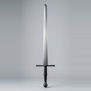 Blackened blunt longsword trainer with a dark cross and pommel, black leather grip and a fuller running two thirds of the blade shown against a plain studio backdrop