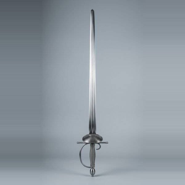 Blackened smallsword trainer with a pierced oval shell guard, olive pommel and dark wire bound grip standing point up against a plain grey studio backdrop