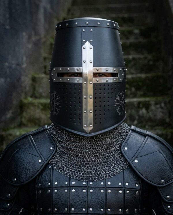Blackened steel great helm with polished cross reinforce and chased vegvisir worn over a chainmail collar and riveted black leather armour