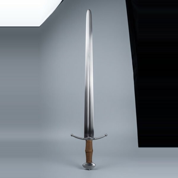 Blunt arming sword trainer with a broad fullered double edged blade, ball tipped cross guard, flattened sphere pommel and tan cord grip on a plain studio backdrop