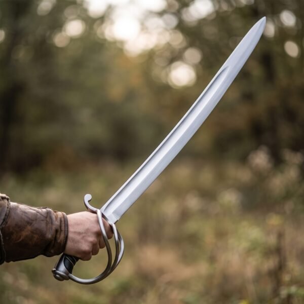 Curved sabre trainer with steel three bar hilt held out in one hand in front of an autumn field