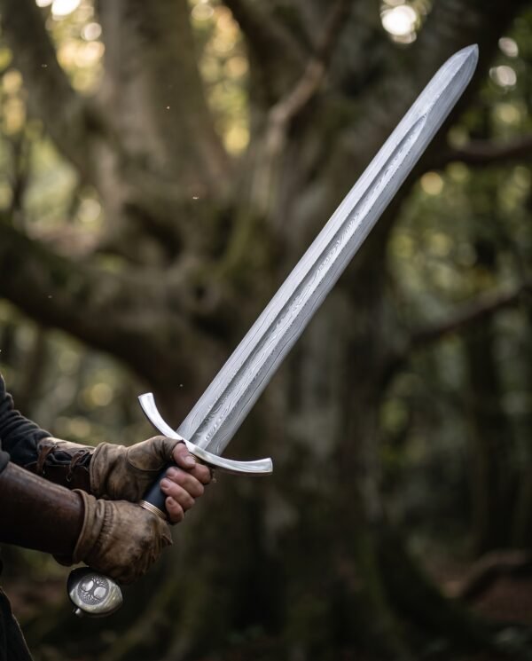 Damascus arming sword with swept steel cross guard and black leather grip held two handed in an old woodland