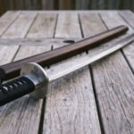 Ravenwake Hand Forged Damascus Katana | 1095 and 15N20 Layered Blade | Triskele Engraved Steel Guard with Cord Wrapped Grip and Hardwood Saya | Norse Collector Gift | RK-2010