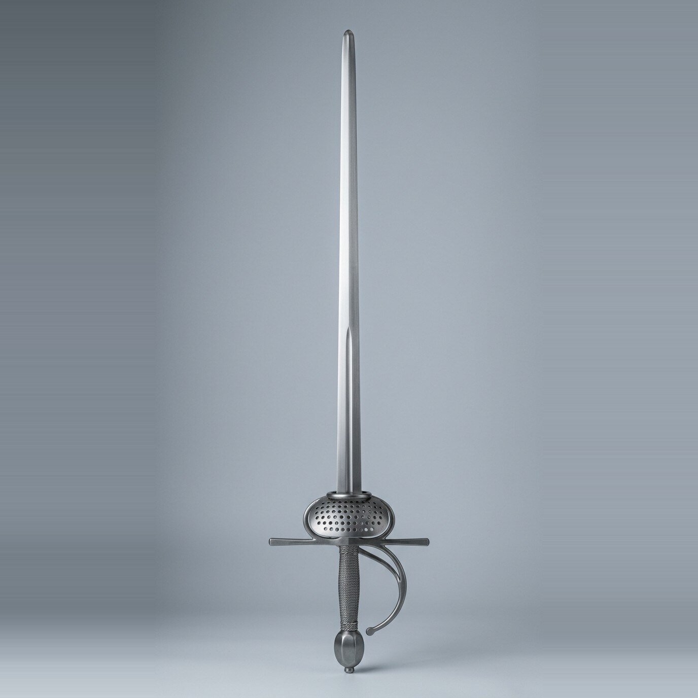 Corvalde dish hilt rapier trainer with branch bar Dish hilt rapier trainer with a shallow pierced dish, knuckle bow and branch bar, steel wire wrapped grip and faceted olive pommel standing point up against a plain grey studio backdrop