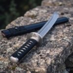 Fine conventional point on an etched Damascus tanto, bright steel furniture and a matt black scabbard