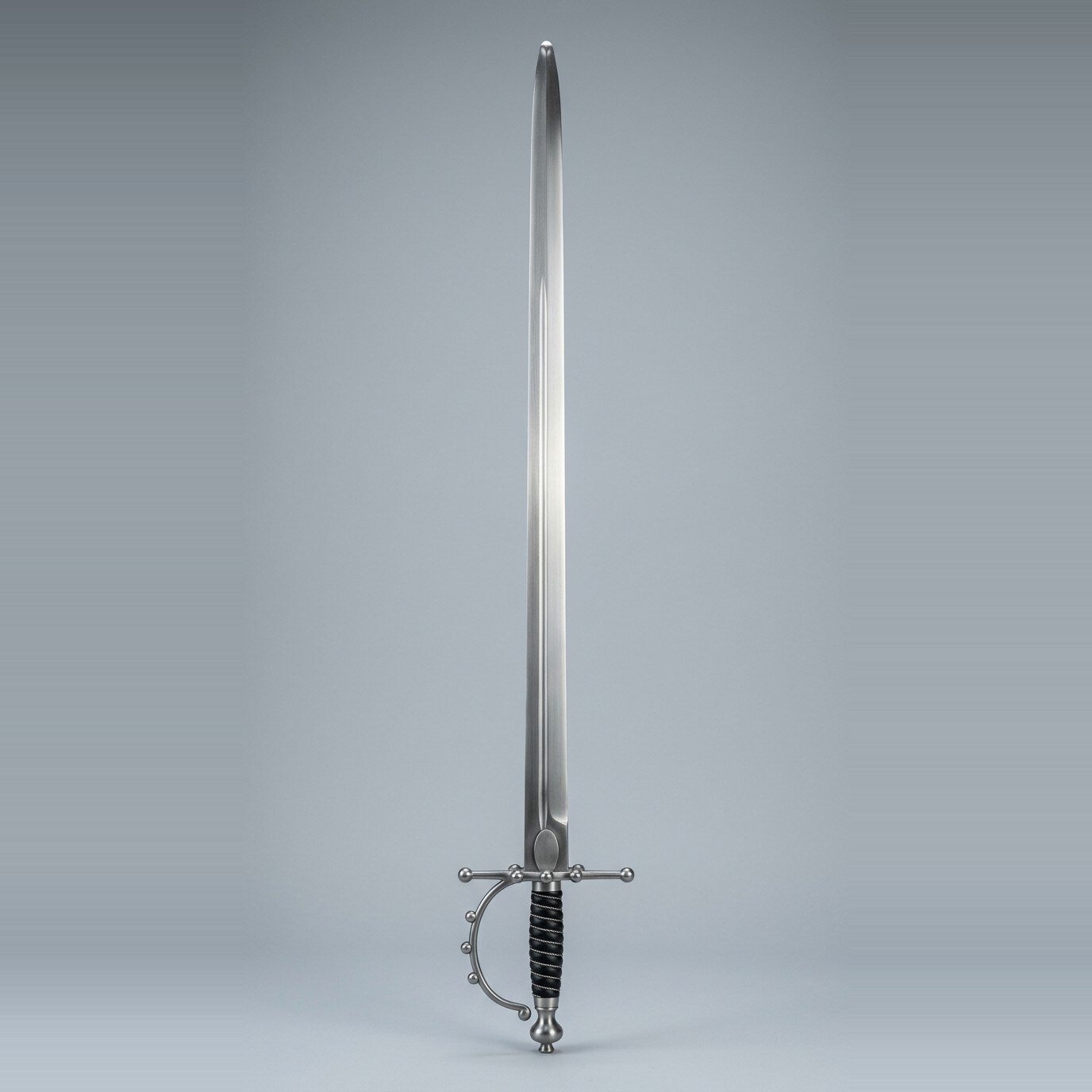 Skaldrun five ball spadroon trainer RK-3003 Five ball hilt spadroon trainer with a straight single edged blunt blade, urn pommel and black grip bound with wire against a plain studio backdrop