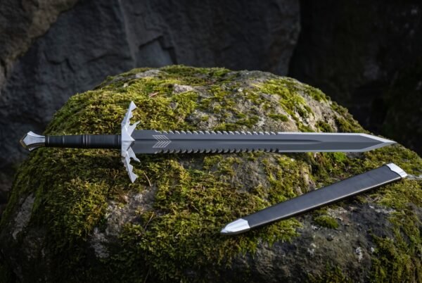 Hand forged 1095 steel sawback fantasy sword with a spiked crossguard and black scabbard lying on a moss covered boulder in shadowed woodland