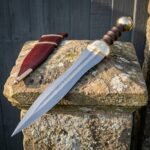 Legionward Hand Forged Damascus Gladius Short Sword | 27 Inch Overall Length | Brass Fittings and Turned Hardwood Grip with Oxblood Leather Scabbard | Roman Collector Gift | RK-1671