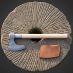 Hand forged triquetra axe laid on an old millstone, damascus bearded head with a trinity knot engraved cheek, pale ash haft and a tan leather edge cover