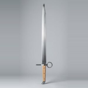 Langes messer trainer with a single edged blunt blade, ring nagel on the flat, three brass rivets through pale wood scales and a beak shaped butt cap on a plain studio backdrop