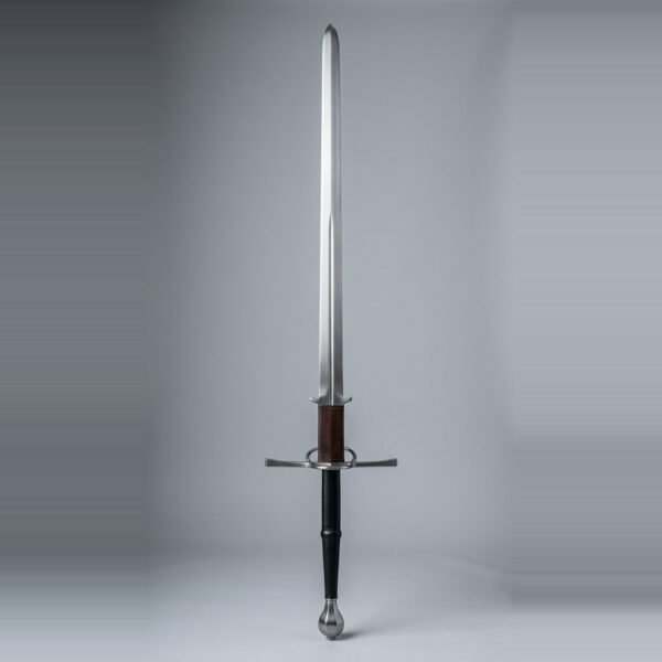 Montante greatsword with a straight double edged blade, leather wrapped ricasso, parierhaken hooks, a side ring on the guard and a faceted pear pommel over a long two hand grip against a plain grey studio backdrop