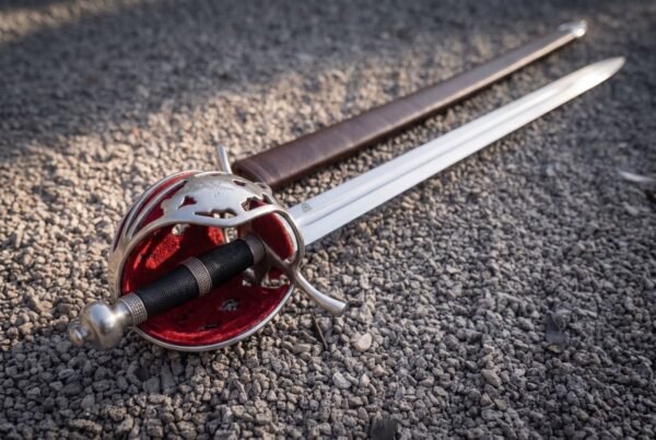 Pierced shell guard with red backing panels, a side ring and a steel knuckle bow