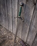 Raised Mjolnir standing proud on a round blackened pommel