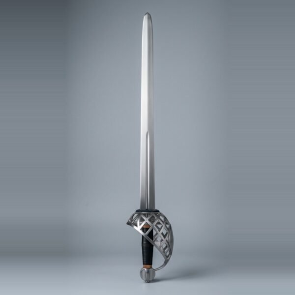 Schiavona basket hilt sword with a full bar steel basket, lobed cap pommel and black ribbed grip with brass ferrules standing point up against a plain grey studio backdrop