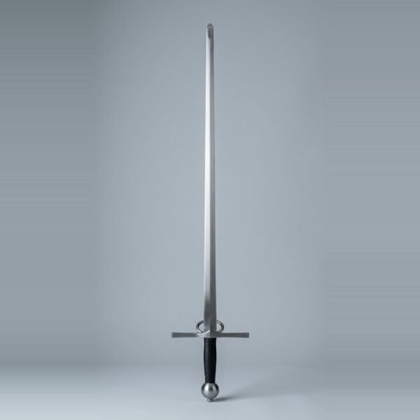Side ring arming sword trainer with two rings above a straight cross, a narrow unfullered blade, black leather grip and sphere pommel laid on a plain grey studio backdrop