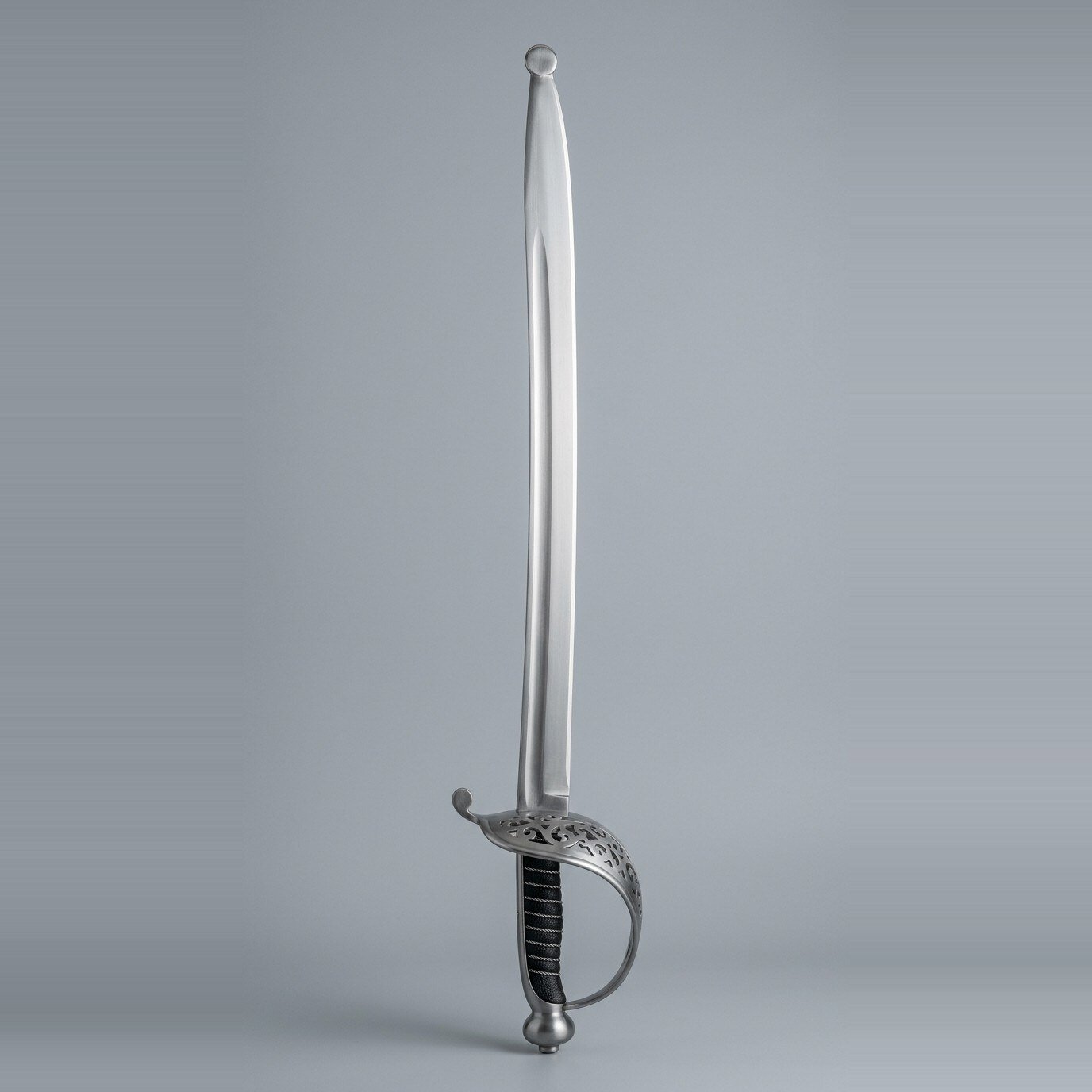 Orlunde spadroon practice sword Spadroon practice sword with a pierced openwork shell guard, ball finial quillon, onion pommel and ray skin grip bound with wire, a round steel blunting ball fitted over the point, against a plain grey studio backdrop