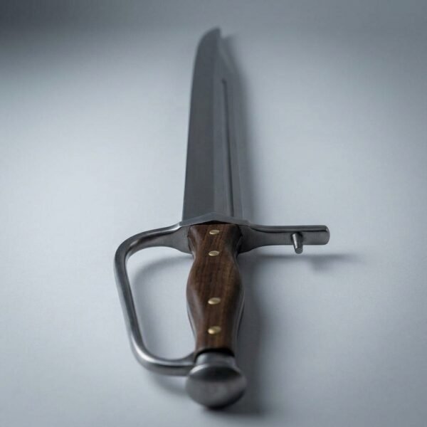 Steel langes messer with knuckle bow and wood scale grip with brass pins on a plain grey background