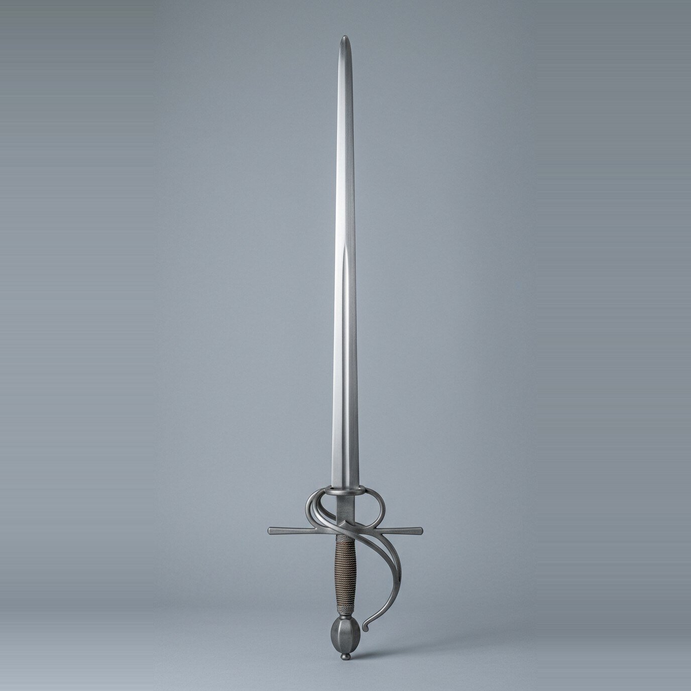 Orveldt Swept Hilt Sidesword RK-3017 Swept hilt sidesword trainer with a side ring, counterguard bar, brass wire wound grip and olive pommel set against a plain grey studio backdrop
