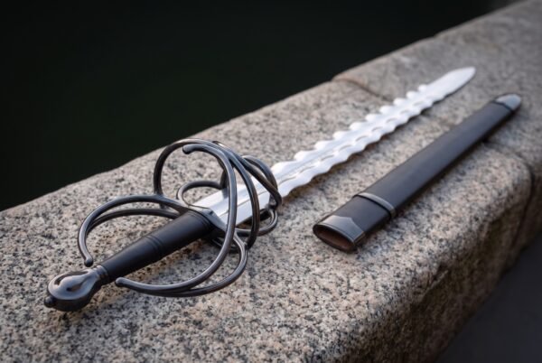 Twenty one inch flame profile blade in mirror polished steel, waves running its full length