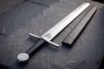Valknut etched into the blade flat just below the square section guard
